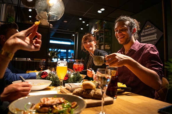 Group of friends have a bite to eat in Roermond over the holidays
