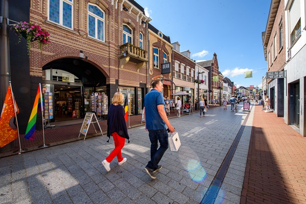 Shoppers stroll down the Langstraat in Weert
